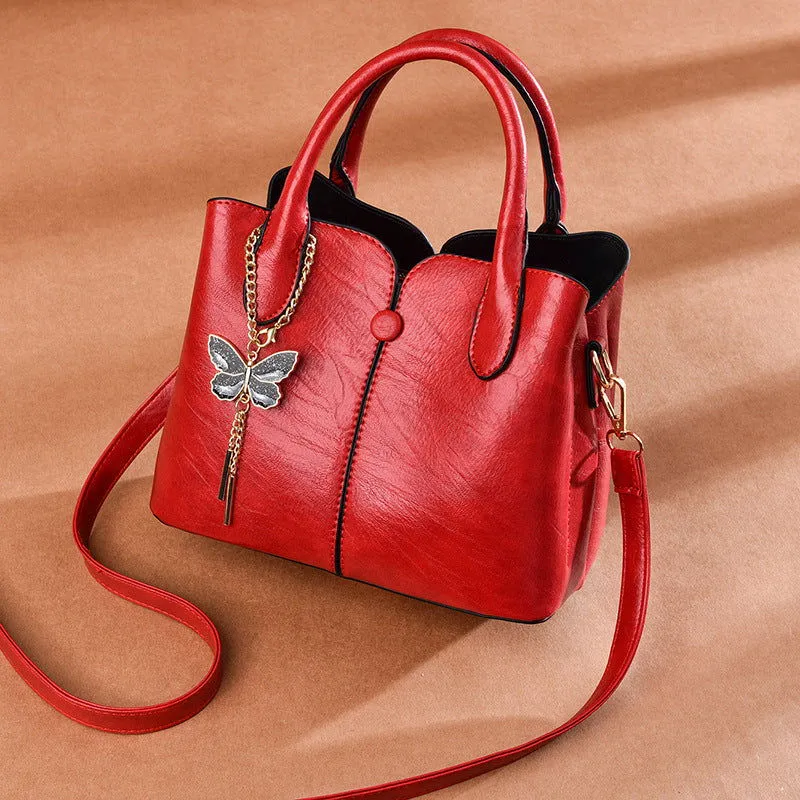 Butterfly Pendant Top Handle Satchel Leather Handbags